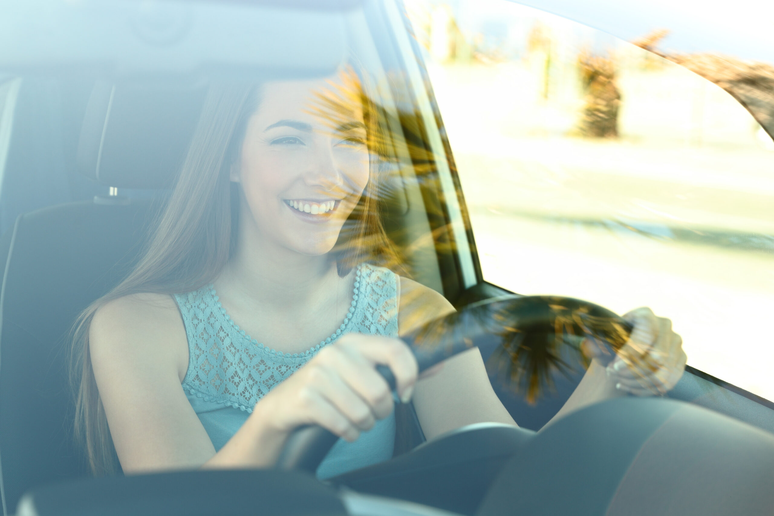 Portrait,Of,A,Happy,Attentive,Driver,Woman,Driving,A,Car